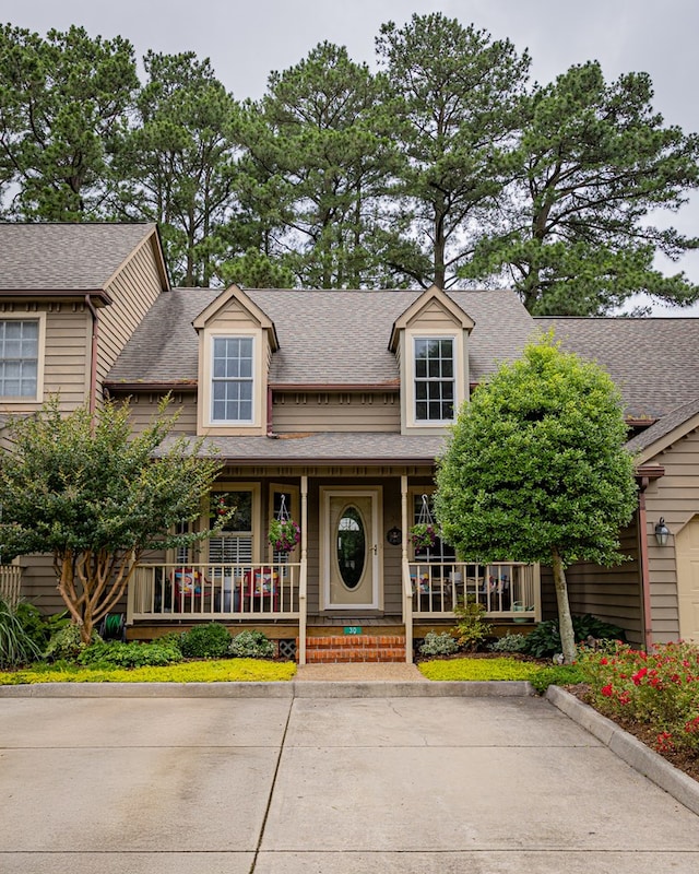 30 Heatherfield Ct, Kilmarnock, VA 22482 - view of front of property with covered porch and a shingled roof