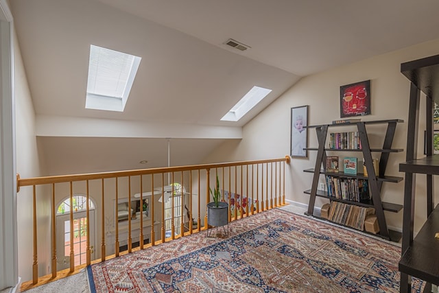 30 Heatherfield Ct, Kilmarnock, VA 22482 - living area with a skylight, vaulted ceiling, and carpet