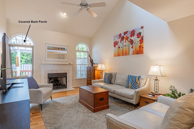 30 Heatherfield Ct, Kilmarnock, VA 22482 - living room with wood finished floors, high vaulted ceiling, plenty of natural light, a ceiling fan, and a fireplace