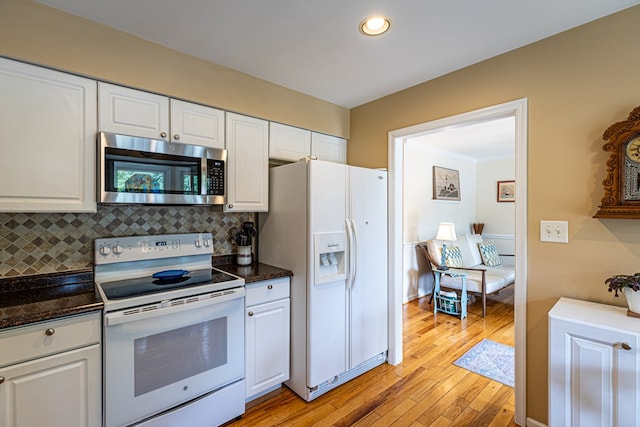 30 Heatherfield Ct, Kilmarnock, VA 22482 - kitchen featuring white appliances, white cabinets, light wood-style floors, and recessed lighting