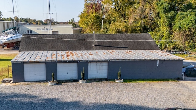 exterior space with a garage and an outdoor structure