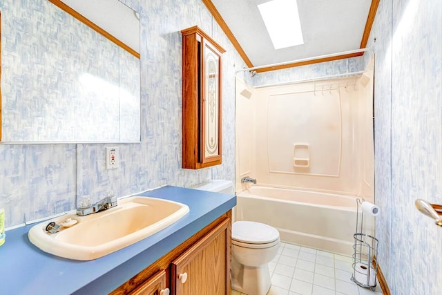 full bathroom featuring a skylight, tile patterned floors, ornamental molding, shower / washtub combination, and toilet