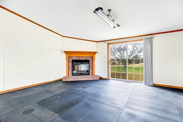 unfurnished living room with ornamental molding and a fireplace