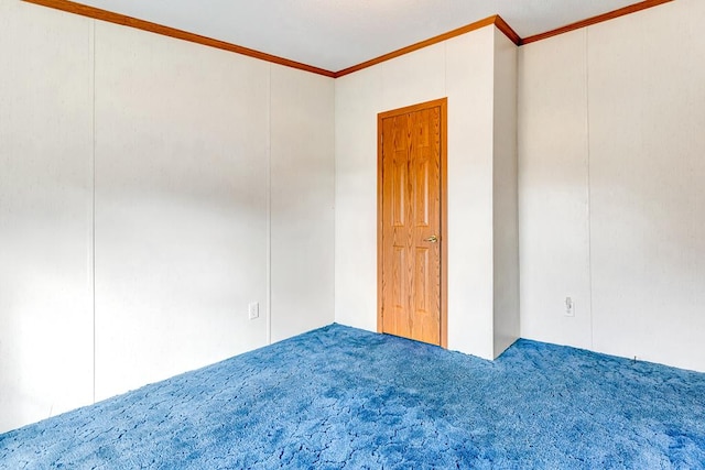 carpeted empty room with crown molding