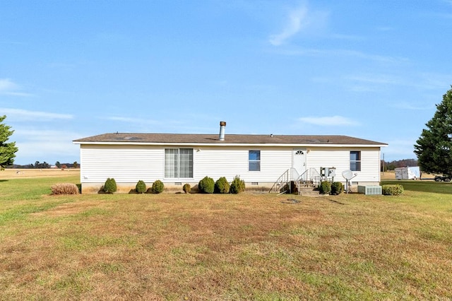 back of house featuring a yard