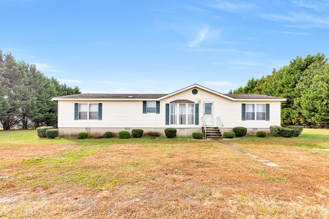 manufactured / mobile home with a front lawn