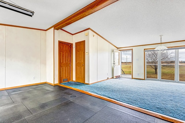 empty room with dark colored carpet, vaulted ceiling with beams, crown molding, and a textured ceiling