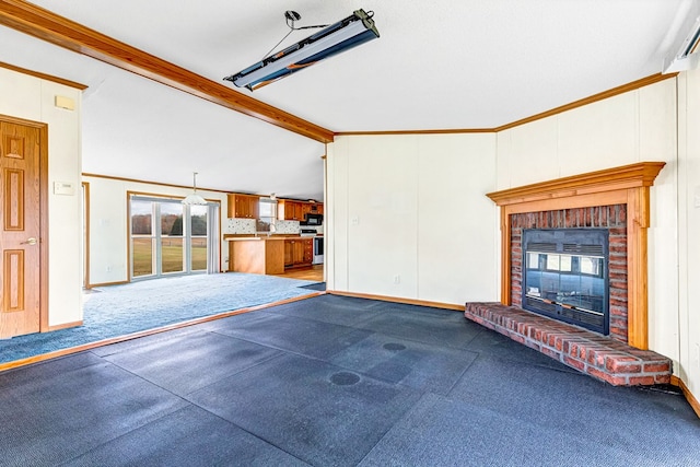 unfurnished living room featuring carpet flooring, vaulted ceiling with beams, crown molding, and a fireplace