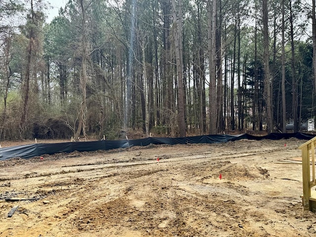 view of yard with a wooded view