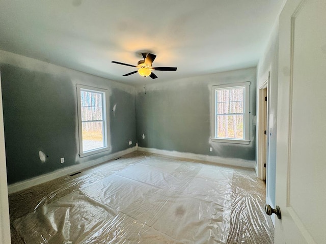 bedroom featuring baseboards and ceiling fan