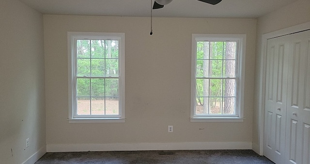 30 Parrish Loop, Montross, VA 22520 - unfurnished dining area featuring ceiling fan, baseboards, and dark colored carpet