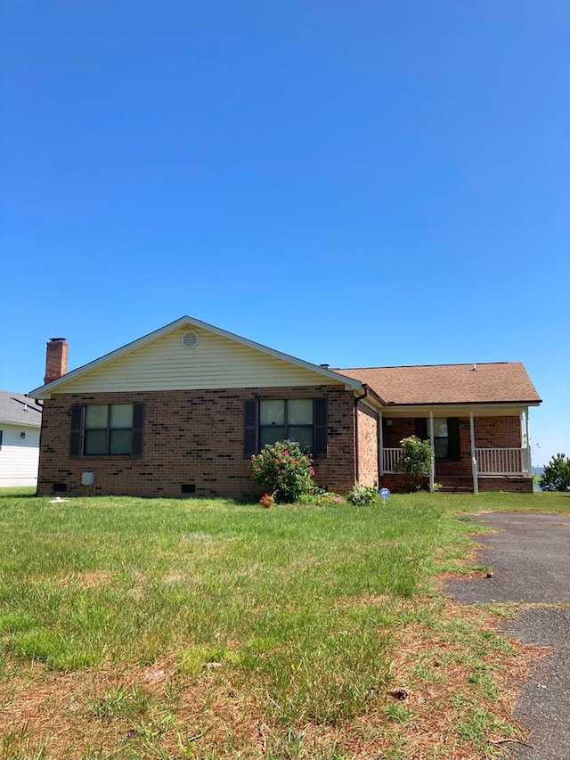 899 N Glebe Rd, Montross, VA 22520 - ranch-style home featuring brick siding and a front lawn