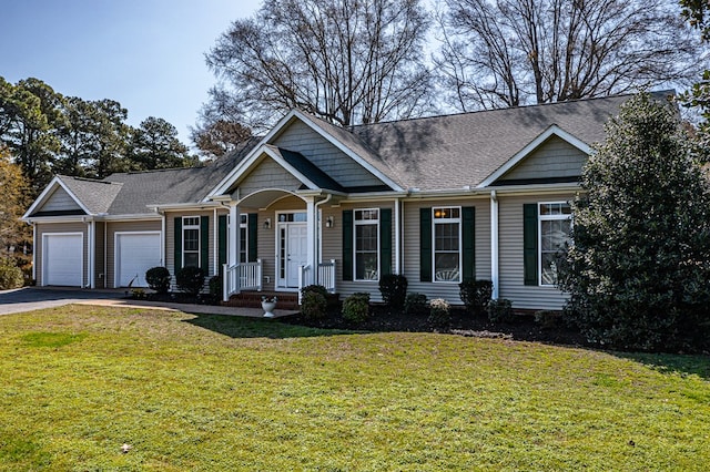 ranch-style home with driveway, an attached garage, a front lawn, and roof with shingles