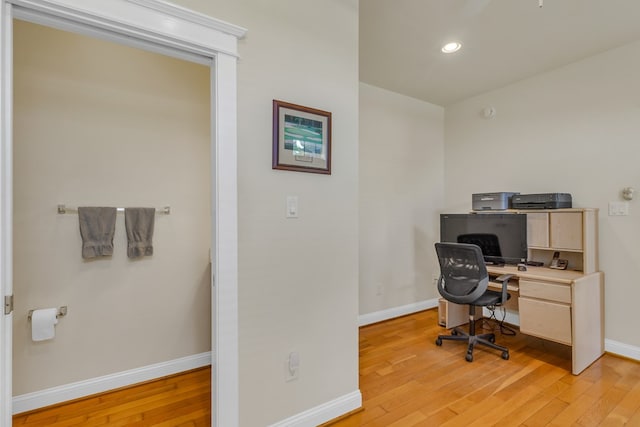 home office featuring baseboards, recessed lighting, and light wood-type flooring