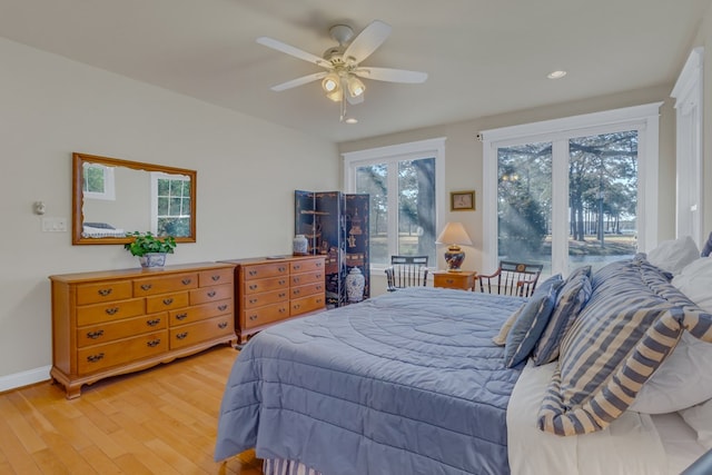 bedroom featuring baseboards, light wood-type flooring, recessed lighting, and a ceiling fan