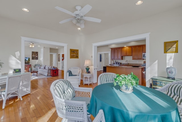 dining room featuring french doors, light wood-style flooring, ceiling fan, and recessed lighting