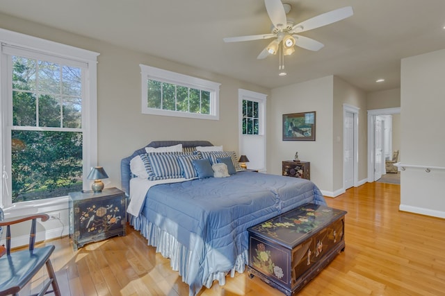 bedroom with baseboards, ceiling fan, recessed lighting, and light wood-style floors