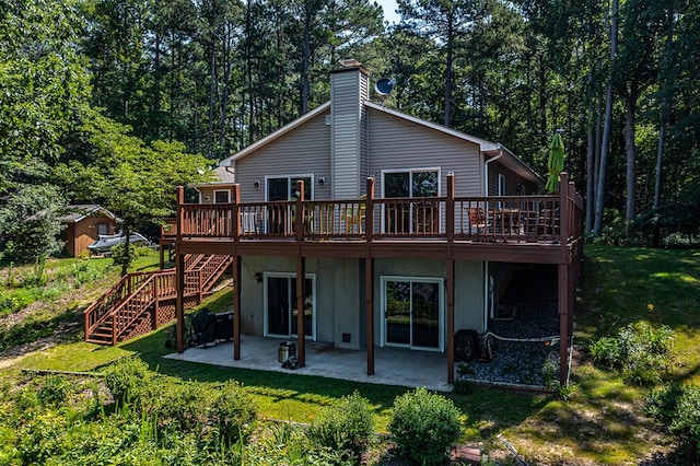 604 High Point Trl, Heathsville, VA 22473 - rear view of property featuring stairway, a deck, a patio, and a yard