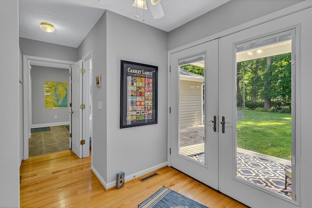 604 High Point Trl, Heathsville, VA 22473 - entryway with french doors, light wood-style floors, and a ceiling fan