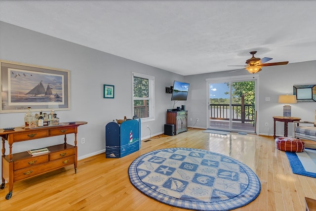 604 High Point Trl, Heathsville, VA 22473 - living room featuring wood finished floors, ceiling fan, and healthy amount of natural light