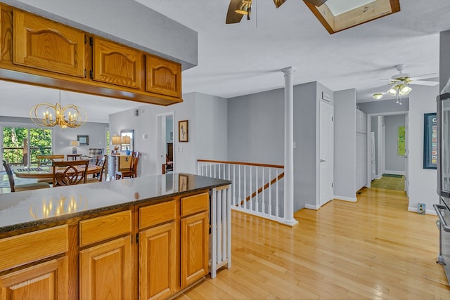 604 High Point Trl, Heathsville, VA 22473 - kitchen with ceiling fan, brown cabinets, and light wood-type flooring