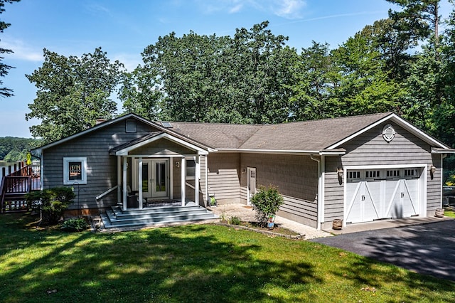 604 High Point Trl, Heathsville, VA 22473 - view of front of house with an attached garage, a front yard, and asphalt driveway