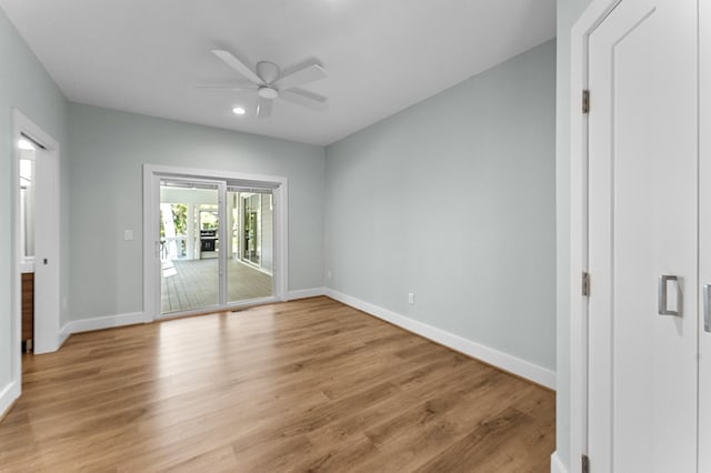 unfurnished bedroom featuring access to outside, light hardwood / wood-style flooring, and ceiling fan