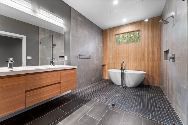 bathroom with tile patterned floors, vanity, and independent shower and bath