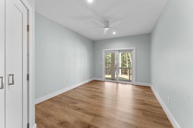 unfurnished room with ceiling fan and light hardwood / wood-style flooring