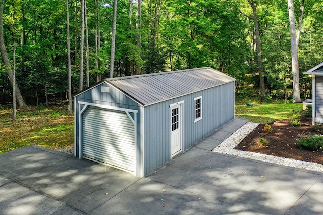 view of outbuilding featuring a garage