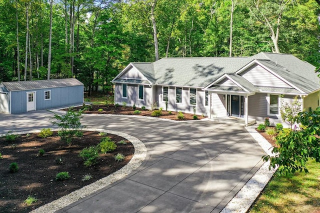 view of front of house featuring an outbuilding and a garage