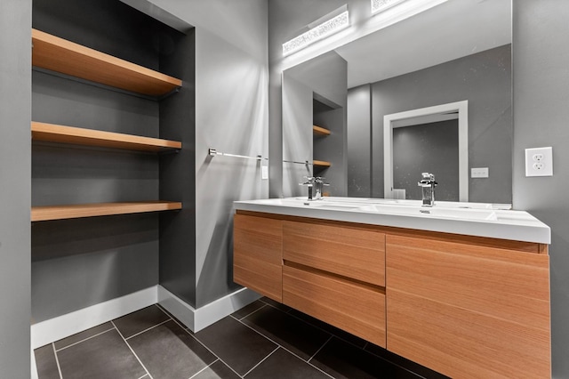 bathroom with tile patterned flooring, vanity, and built in features