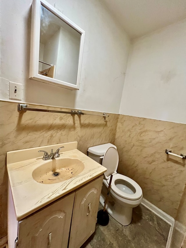 448 Poor Jack Rd, Montross, VA 22520 - bathroom featuring toilet, vanity, and a wainscoted wall