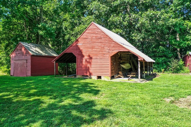 view of outbuilding featuring a lawn