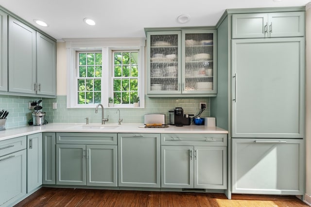 kitchen featuring decorative backsplash and sink