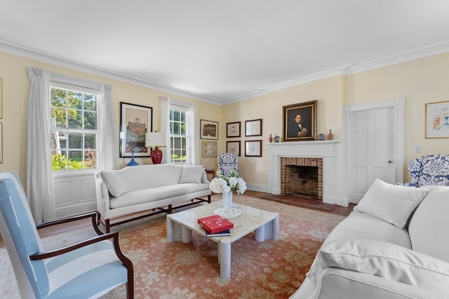 living room with crown molding and a brick fireplace