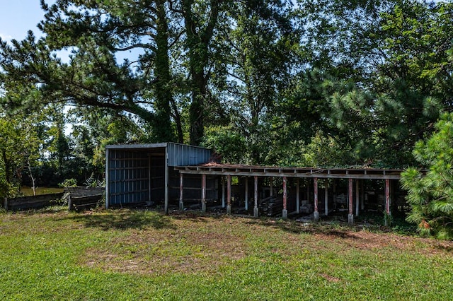 view of outbuilding with a yard