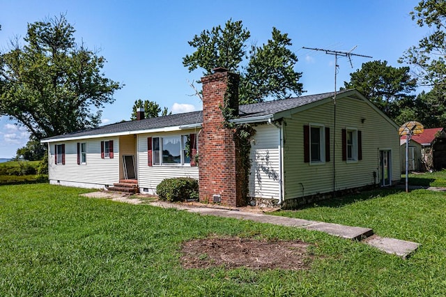 ranch-style home with a front lawn