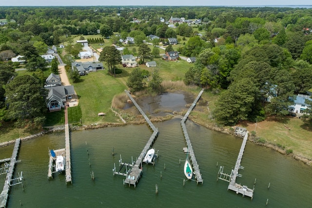 drone / aerial view with a water view and a view of trees