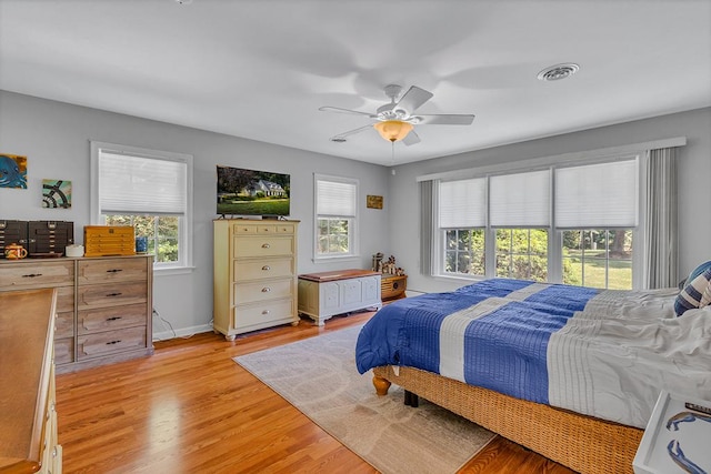 889 Taylors Creek Rd, Weems, VA 22576 - bedroom with light wood-style floors and ceiling fan