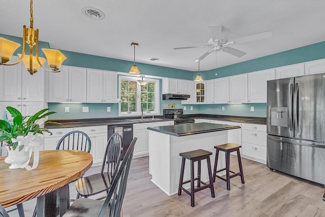 889 Taylors Creek Rd, Weems, VA 22576 - kitchen with stainless steel fridge with ice dispenser, black / electric stove, dark countertops, under cabinet range hood, and white cabinets