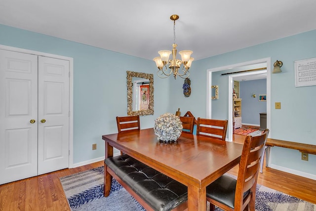 889 Taylors Creek Rd, Weems, VA 22576 - dining space featuring a chandelier and light wood-type flooring