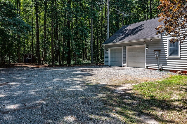 889 Taylors Creek Rd, Weems, VA 22576 - garage featuring a forest view