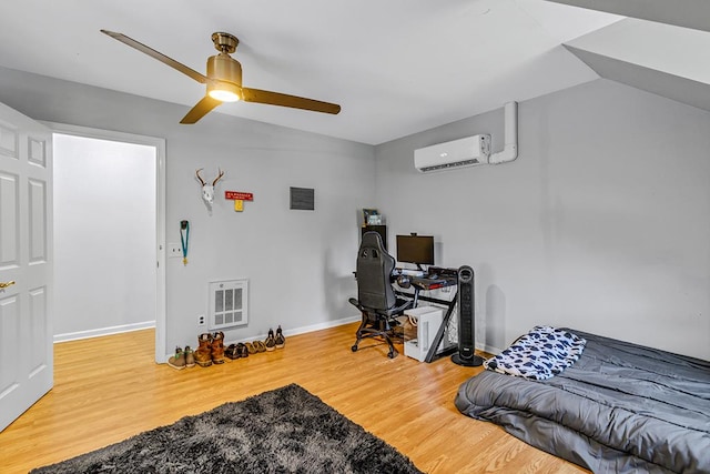 889 Taylors Creek Rd, Weems, VA 22576 - office with a wall mounted air conditioner, ceiling fan, wood finished floors, heating unit, and lofted ceiling
