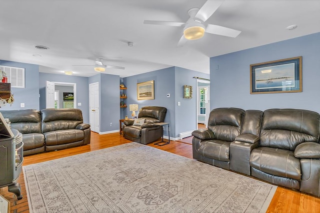 889 Taylors Creek Rd, Weems, VA 22576 - living room with a ceiling fan, healthy amount of natural light, and wood finished floors