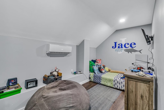 889 Taylors Creek Rd, Weems, VA 22576 - bedroom with a wall mounted air conditioner, vaulted ceiling, and wood finished floors