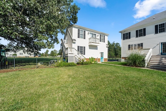 480 Rockingham Rd, Dunnsville, VA 22454 - view of yard with fence, cooling unit, and stairs