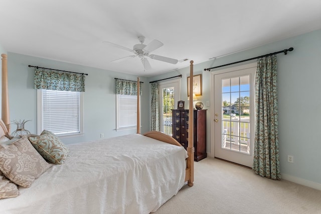 480 Rockingham Rd, Dunnsville, VA 22454 - bedroom with baseboards, a ceiling fan, visible vents, access to exterior, and carpet