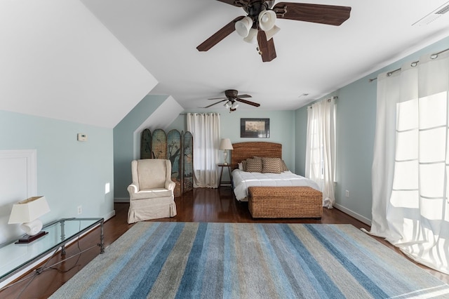 480 Rockingham Rd, Dunnsville, VA 22454 - bedroom with baseboards, vaulted ceiling, dark wood-type flooring, visible vents, and ceiling fan