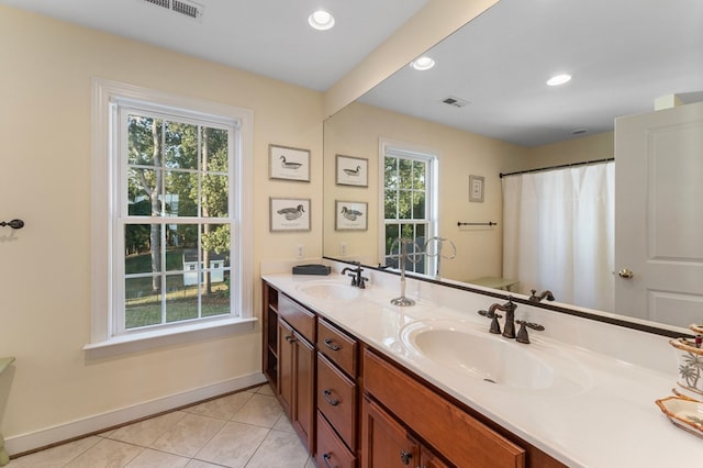 480 Rockingham Rd, Dunnsville, VA 22454 - bathroom with a sink, tile patterned flooring, visible vents, and recessed lighting